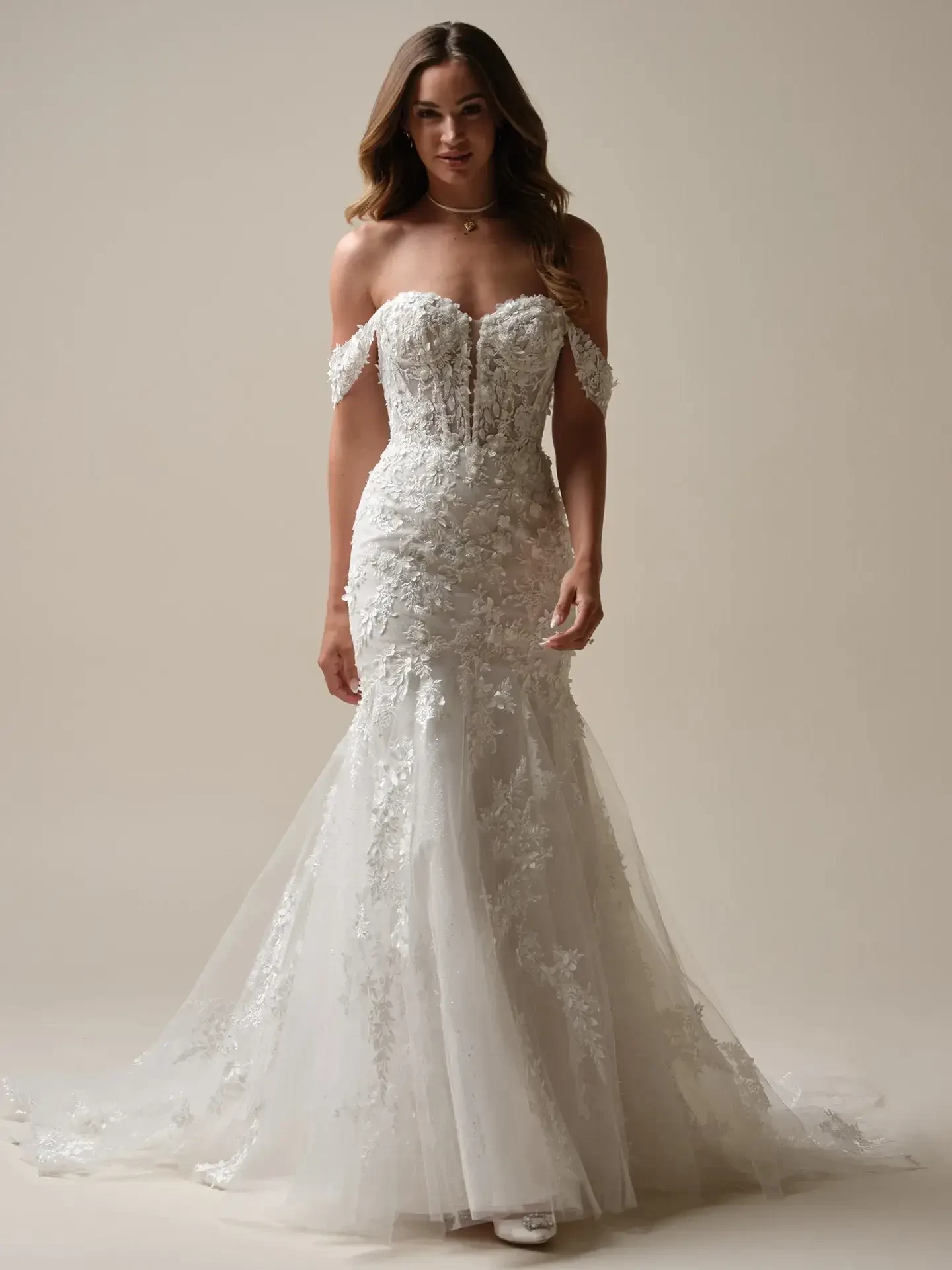 Model is wearing a 3D floral lace fit and flare wedding dress by maggie sottero