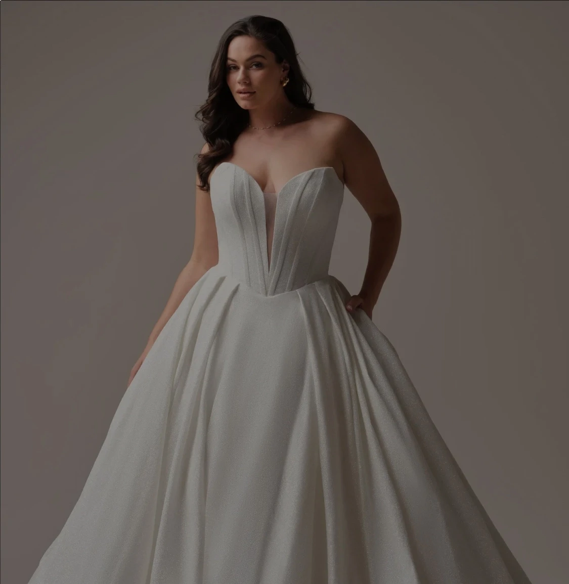 Model wearing white gowns from different bridal collections