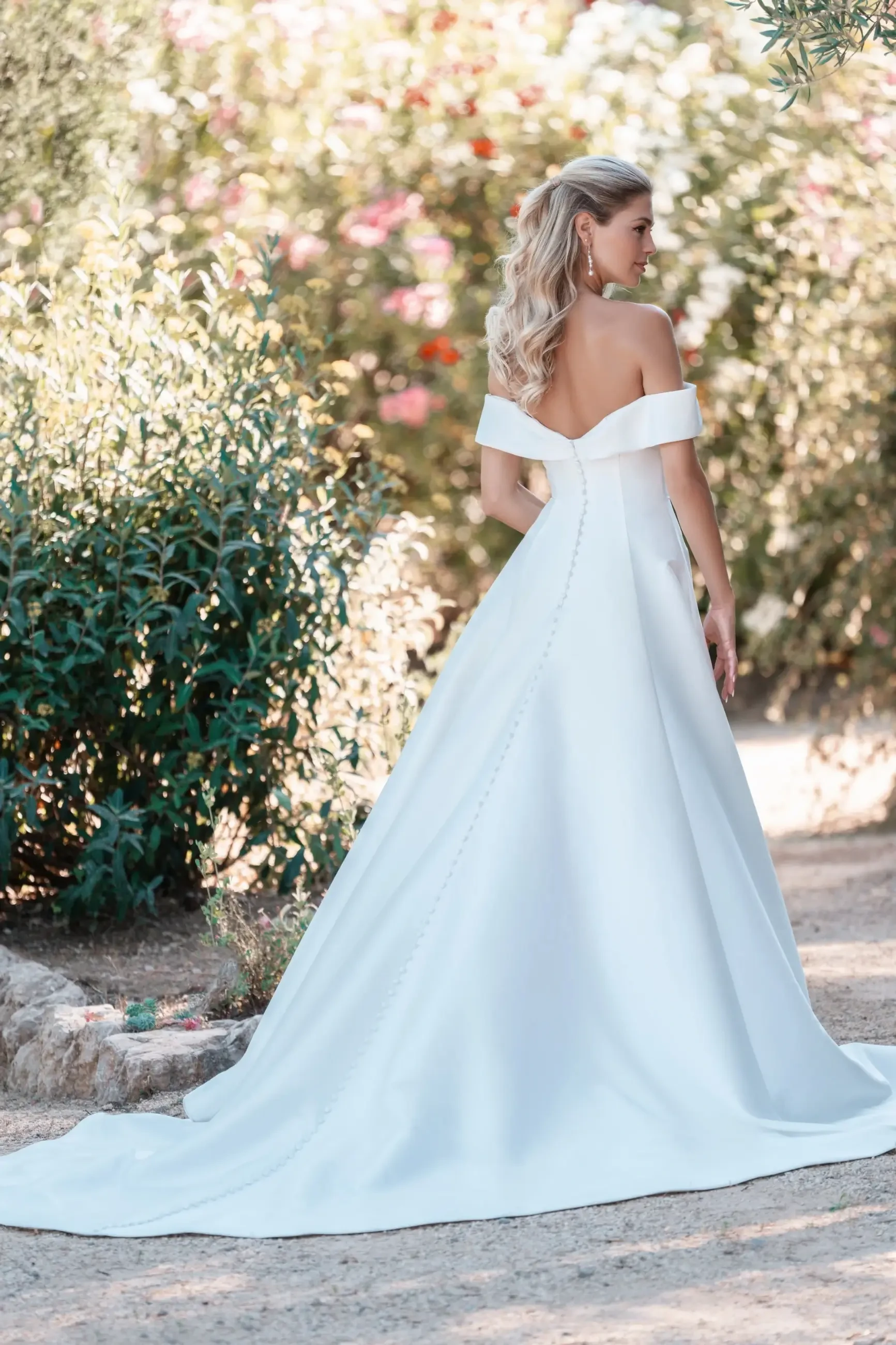 Model is wearing an a-line mikado wedding dress by allure bridals