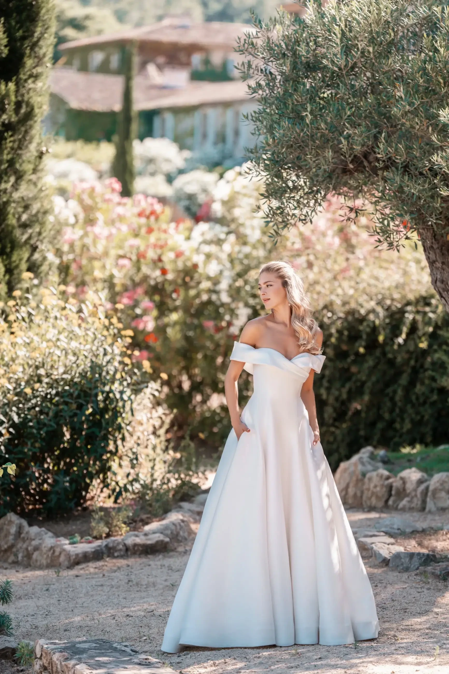 Model is wearing an a-line mikado wedding dress by allure bridals