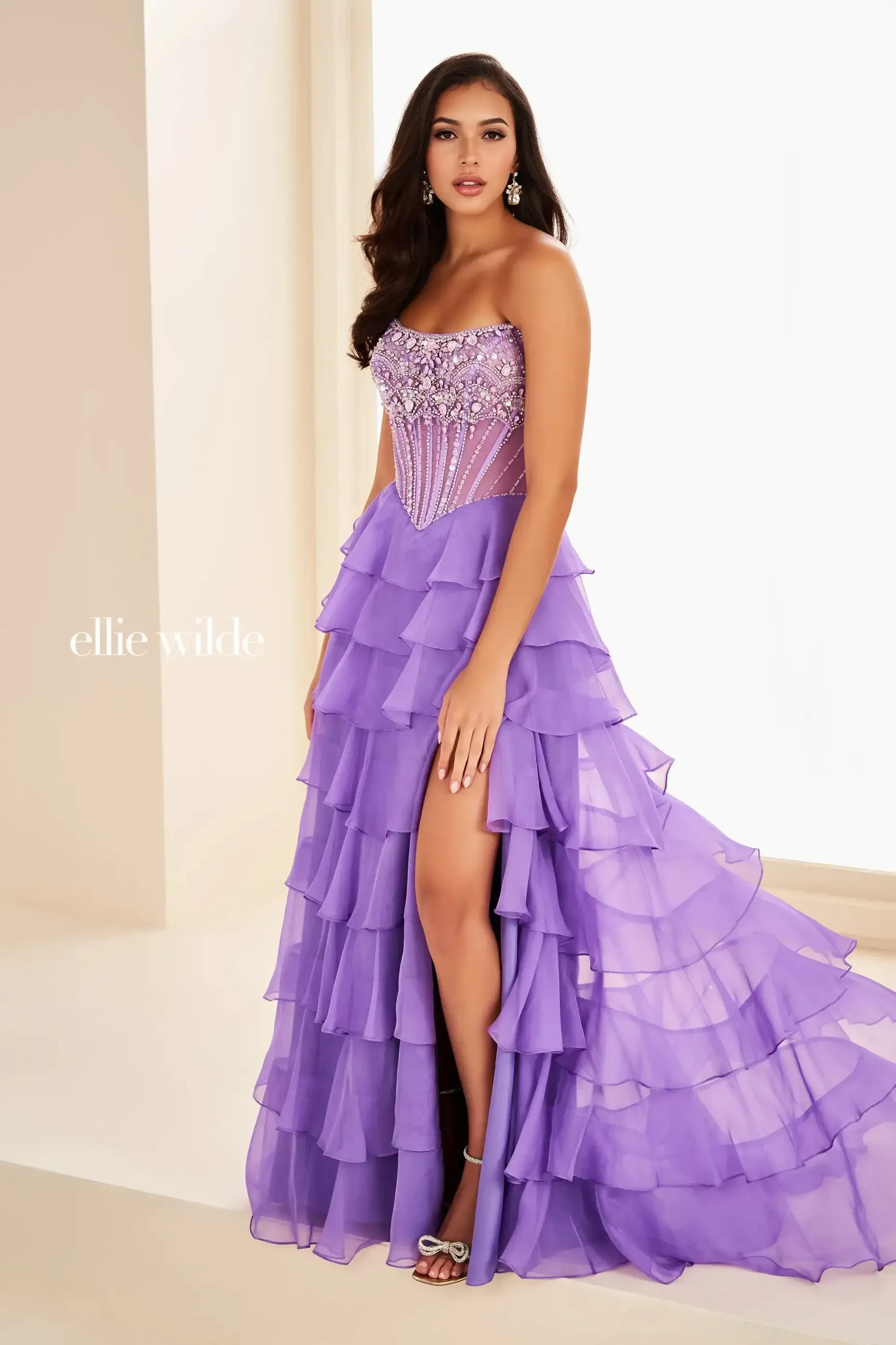model is wearing a sleeveless lavender a-line prom dress